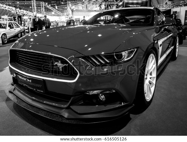 STUTTGART, GERMANY - MARCH\
03, 2017: Pony car Ford Mustang GT AM2 Fastback Coupe, 2016. Black\
and white.Europe\'s greatest classic car exhibition \