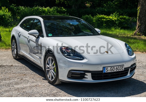 STUTTGART, GERMANY - MAY 8, 2018:\
Porsche Panamera 4 e-hybrid parked outside during a test-drive\
event. Panamera 4 e-hybrid eqipped with a 14.1-kWh battery and\
electric 136-hp\
motor/generator.
