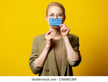 Style Blonde Woman In Jacket With Greek Flag On Yellow Background