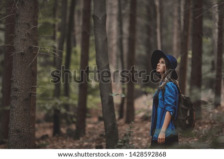 Similar – Image, Stock Photo Blonde girl with hat and hands in the head enjoying relaxed the nature in forest.