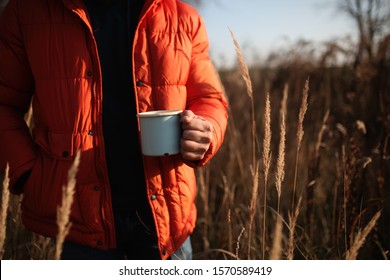 Style Man In Down Jacket With Cup Of Coffee At Rural Autumn Outdoor