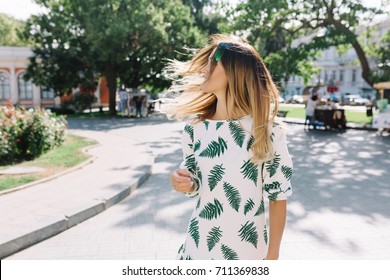 Style Pretty Woman Walking On The Street And Has Fun, She Is Dancing And Turn Her Head. She Has Great Smile And Big Eyes. Good Sunny Day. Great Emotions. Good Mood. 