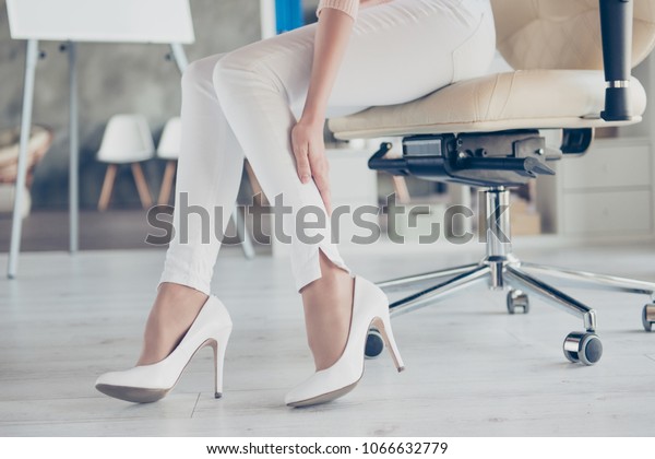 Style\
stylish under trend trouble corporate boss ankle pants beauty palm\
people person concept. Cropped close up photo of delicate woman\'s\
hand touching unhealthy leg suffering from\
pain