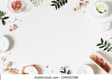 Styled Beauty Frame, Web Banner. Skin Cream, Tonicum Bottle, Dry Flowers, Leaves, Rose And Himalayan Salt. White Table Background. Organic Cosmetics, Spa Concept. Empty Space, Flat Lay, Top View.