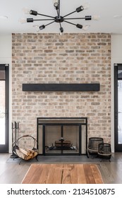 Styled Interior Of Living Room With Fireplace. Close Up Of Custom Brick Fireplace With Empty Mantle. Negative Space For Digital Art.