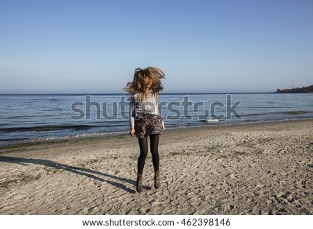 Similar – Young woman standing with closed eyes at the Baltic Sea beach