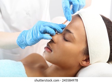 Styling Eyebrows In The Beauty Salon . Hair Removal, Eyebrow Regulation Wax In The Beauty Salon 