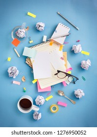 Stylised Messy Brainstorming Working Table Top View With Stationaries And Coffee Cup. Copy Space Image.