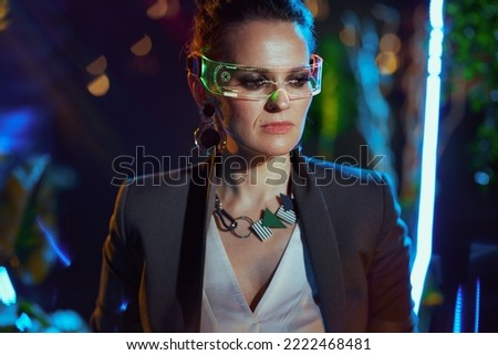 stylish 40 years old business woman with futuristic goggles in metaverse.