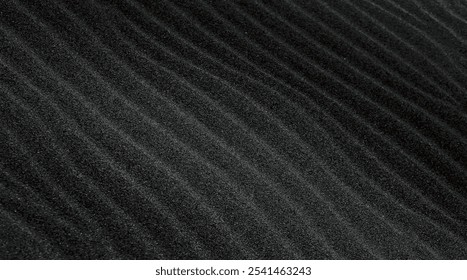 Stylish abstract natural background with black waves, volcanic sand in the desert in minimalist dark colors close-up. - Powered by Shutterstock