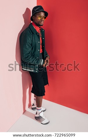 Similar – Black young man listening to music in a sunny day