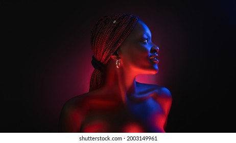 Stylish Afro Girl Portrait Near Pink Blue Neon Light Sign. Portrait In Cool Neon Light.