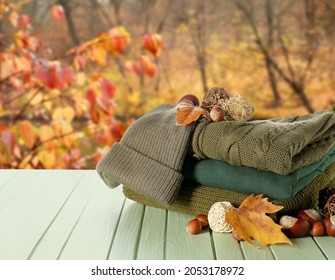 Stylish Autumn Clothes On Table In Autumn Park