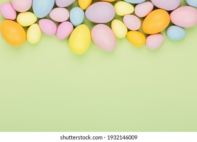 Stylish Background With Colorful Easter Eggs Pastel Colors Isolated On Green Background. Flat Lay, Top View, Mockup, Overhead, Template