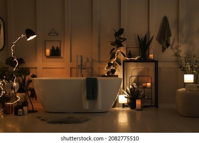 Stylish bathroom interior with houseplants and string lights. Home design - Shutterstock ID 2082775510
