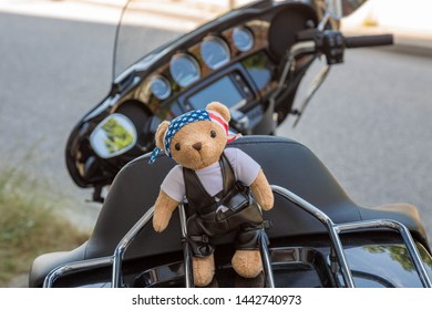 Stylish Bear In Motorcycle Clothes On A Motorcycle