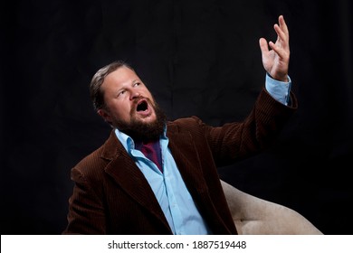 Stylish bearded man dressed in suit singing opera studio portrait on black background
