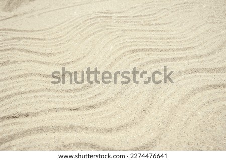stylish beautiful pattern on the sand of the sea in the summer on the nature