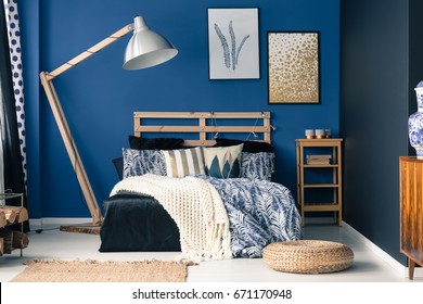 Stylish Bedroom Interior With Dark Blue Wall