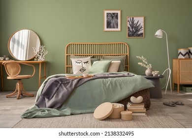 Stylish bedroom interior design with mock up poster frames, bed, side table, rattan commode, vanity table and creative home accessories. Sage green wall. Template. Copy space. - Shutterstock ID 2138332495