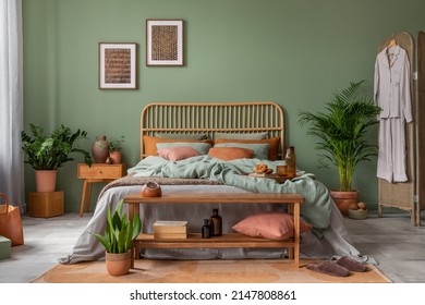 Stylish Bedroom Interior Design With Mock Up Poster Frame, Bamboo Bed, Night Table, Plants, Folding Screen And Creative Home Accessories. Eucalyptus Wall. Template. Copy Space.