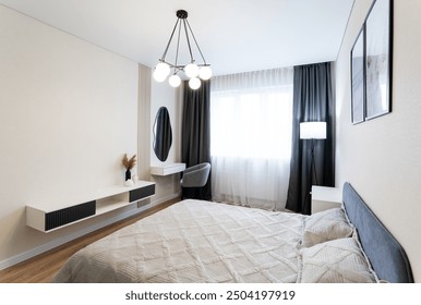 A stylish bedroom that showcases a contemporary design with soft, ambient lighting and minimalist decor, creating a cozy, serene, and inviting atmosphere perfect for relaxation and comfort - Powered by Shutterstock