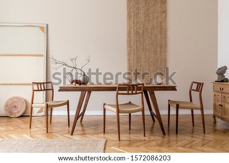 Stylish and beige interior of dining room with design wooden table and chairs, vase with flowers, elegant and rattan accessories. Korean style of home decor. Wooden parquet. Template.