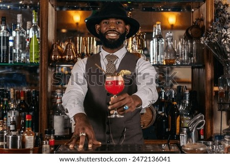 Image, Stock Photo Stylish black bartender preparing a cocktail with a smoke bubble in a traditional cocktail bar