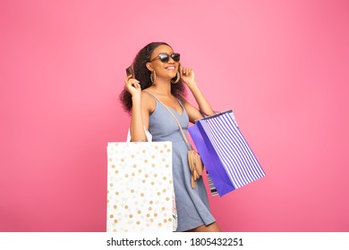 Stylish Black Lady Carrying Shopping Bags And Holding A Credit Card