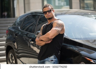 Stylish Black Man, Standing Beside His Fancy Car