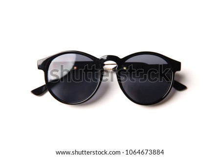 Stylish black sunglasses isolated on white background, top view