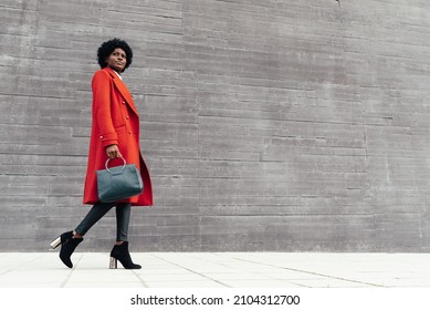 Stylish Black Woman Walking Down The Street. Urban Lifestyle Concept.