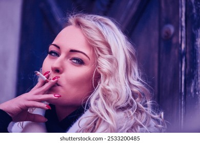 Stylish blonde woman smoking a cigarette outdoors on a cold winter day, exuding allure and controversy with red lipstick - Powered by Shutterstock