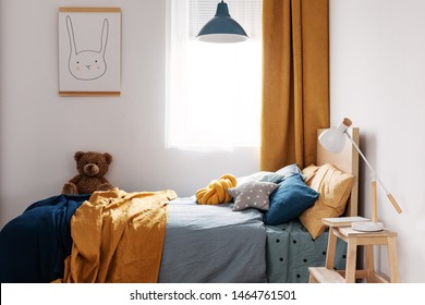 Stylish Blue And Orange Kid's Bedroom Design In Bright Apartment