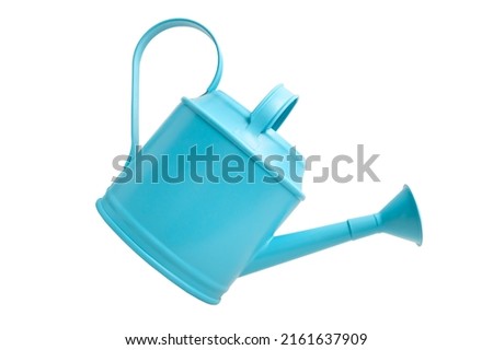 Stylish blue watering can isolated and cutted on a white background. The concept of a garden and hobby and watering of domestic plants