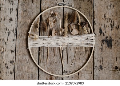 Stylish Boho Autumn Wreath With Dry Flowers Flat Lay. Wooden Hoop, Thread And Dry Herbs On Rustic Wooden Background. Modern Floral Arrangement And Handmade Decor