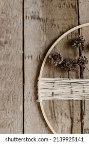 Stylish Boho Autumn Wreath With Dry Flowers Flat Lay. Wooden Hoop, Thread And Dry Herbs On Rustic Wooden Background. Modern Floral Arrangement And Handmade Decor