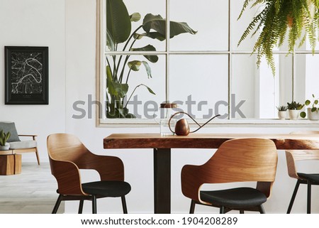 Stylish and botany interior of dining room with design craft wooden table, chairs, a lof of plants, window, poster map and elegant accessories in modern home decor. Template.