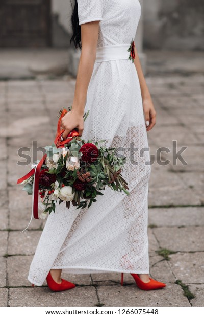 white dress and red shoes