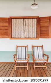 Stylish Bright Courtyard With Wooden Chair, Open Window, Lamp And Wooden Floor. Modern Cottage  Interior Design Concept.