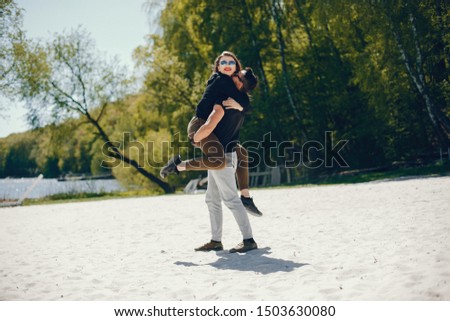 Similar – Couple of tourists walking down the street