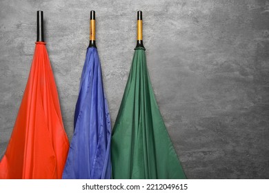 Stylish Bright Umbrellas On Black Background, Closeup