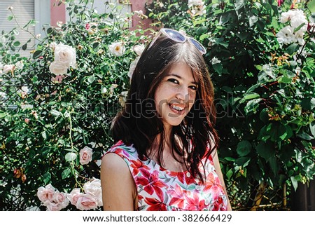 Similar – Young woman with closed eyes laughing over nature background