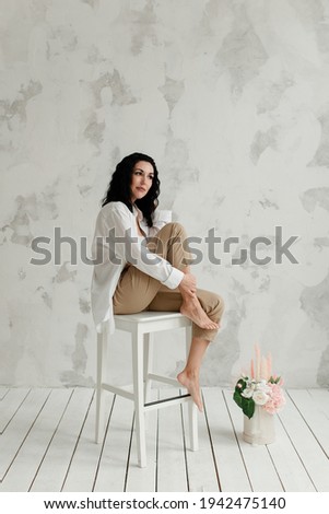 Similar – Woman in work wear in her workshop by table with handmade items