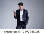 Stylish business portraits of Asian man in suits