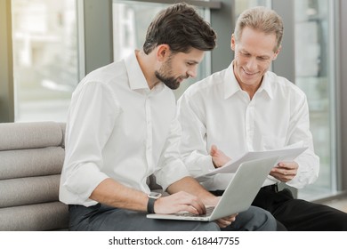 Stylish businessmen working in office - Shutterstock ID 618447755