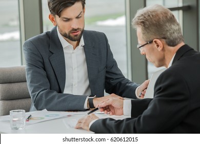 Stylish businessmen working in office - Shutterstock ID 620612015