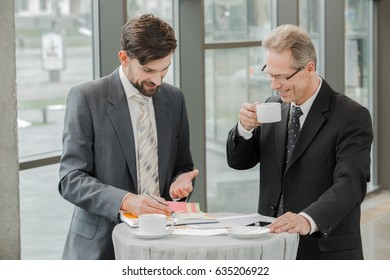 Stylish businessmen working in office - Shutterstock ID 635206922
