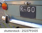 Stylish car in the street of Roma with "RomaGo"