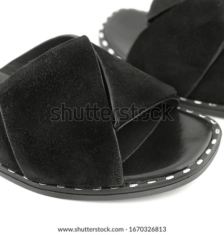 Stylish casual black women`s summer shoes on a white background for the cover of fashion magazine